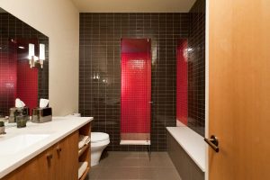 red tiled shower in custom bathroom