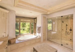 sunken tub and glass walk-in shower