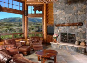 living room in log home with large windows