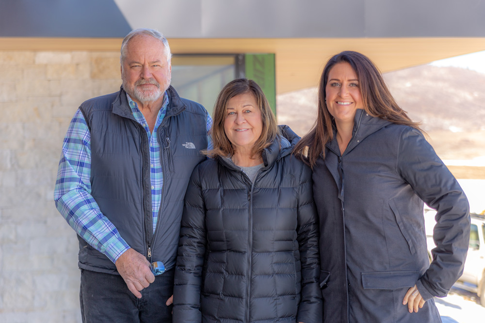 portrait of custom builders John, Kate and Nicole Shively