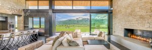 custom construction great room with large windows and mountain view