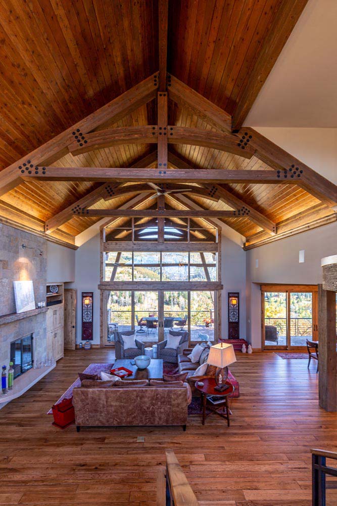 Large tall ceilings with exposed beams in living room.