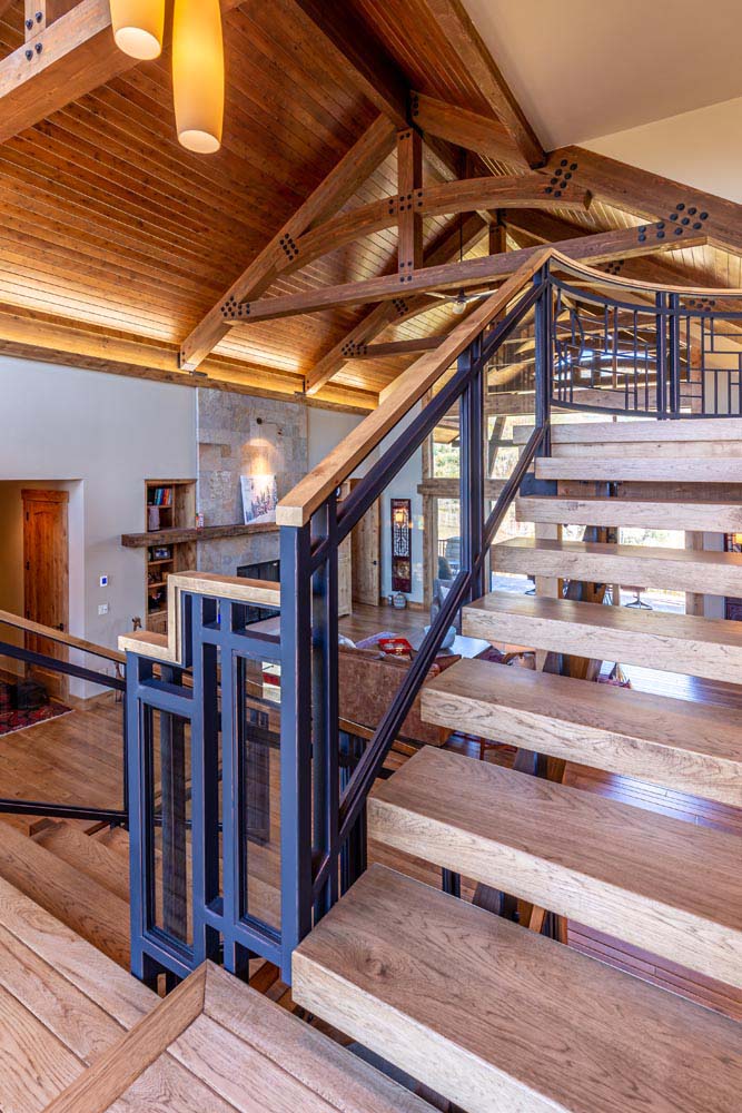 Wood step open staircase with custom railings.