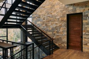 Open stair case and brick wall.