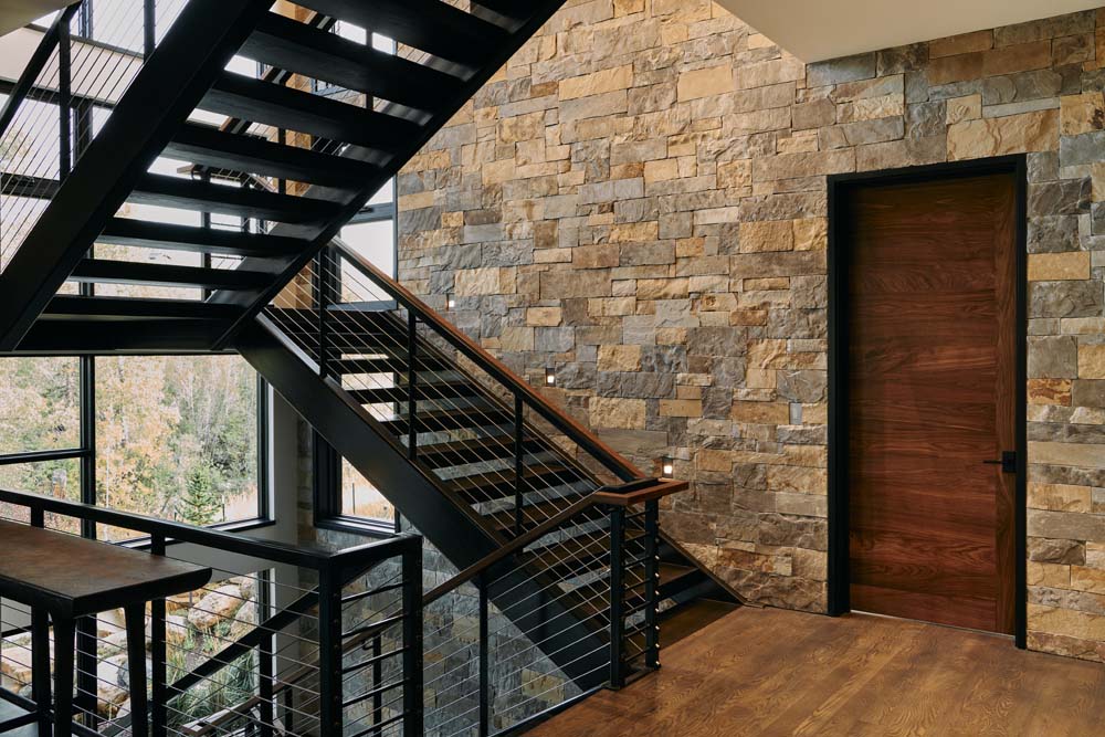 Open stair case and brick wall.