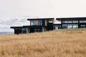 Modern house on a grassy field.